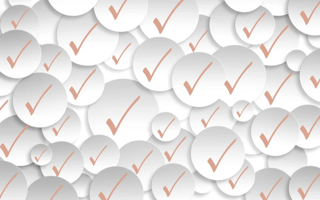 Multiple check marks on white circular backgrounds symbolising a full marketing check-up and audit process.